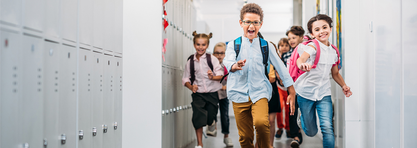 School kids running in a hallway